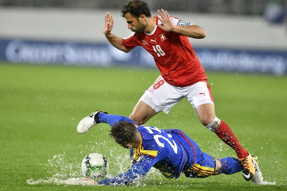 Swiss Admir Mehmedi ,right, fights for the ball against Andorra&#039;s Jordi Rubio, left during the 2018 Fifa World Cup Russia group B qualification soccer match between Switzerland and Andorra at the ...
