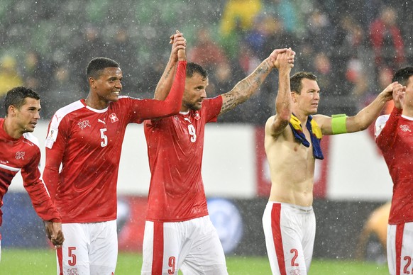 From left, Swiss soccer players Remo Freuler, Manuel Akanji, Haris Seferovic, Stephan Lichtsteiner celebrate after winning the 2018 Fifa World Cup Russia group B qualification soccer match between Swi ...
