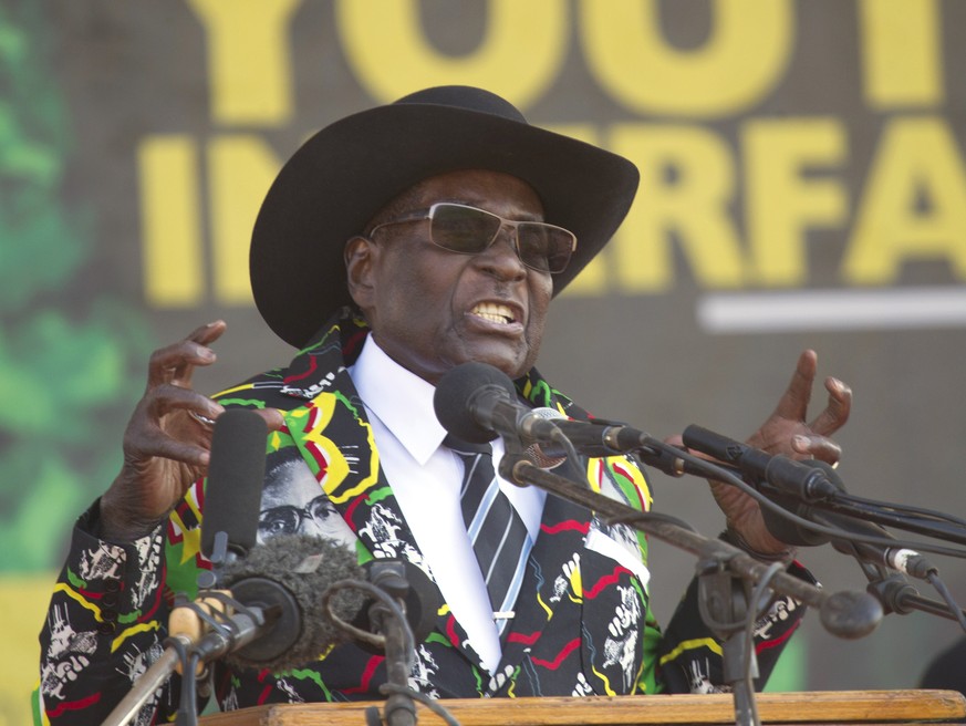 FILE - In this Sept, 1, 2017, file photo, Zimbabwean President Robert Mugabe addresses party supporters at a rally in Gweru, Zimbabwe. Zimbabwe&#039;s army said Wednesday, Nov. 15, 2017, it has Mugabe ...