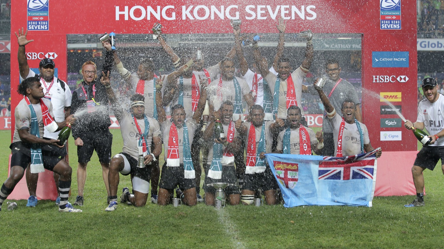 FILE - In this April 10, 2016 file photo, the Fiji rugby team celebrate after winning the final match against New Zealand at the Hong Kong Sevens rugby tournament in Hong Kong. Rugby is returning to t ...