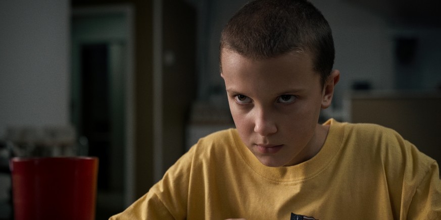 This image released by Netflix shows Millie Bobby Brown in a scene from, &quot;Stranger Things.&quot; The series was nominated for a Golden Globe award for best TV drama on Monday, Dec. 12, 2016. The  ...