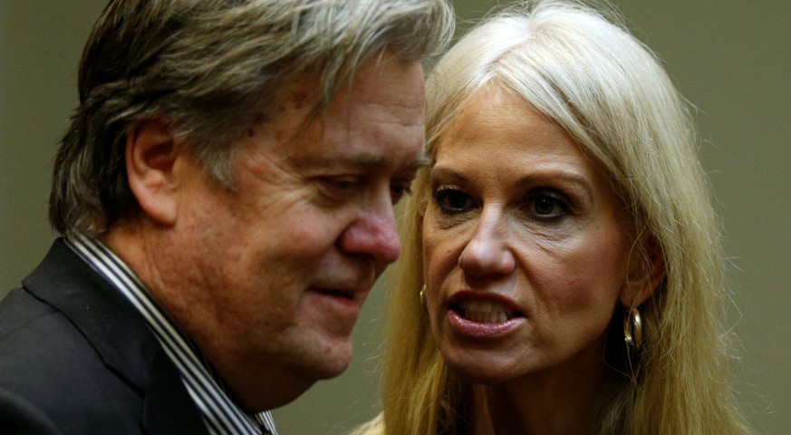 U.S. President Donald Trump&#039;s chief strategist Steve Bannon (L) and senior aide Kellyanne Conway speak at meeting hosted by Trump with cyber security experts in the Roosevelt Room of the White Ho ...