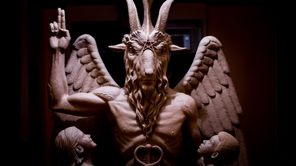 This 2014 photo provided by The Satanic Temple shows a bronze Baphomet, which depicts Satan as a goat-headed figure surrounded by two children. The Satanic Temple, a group advocating the separation of ...