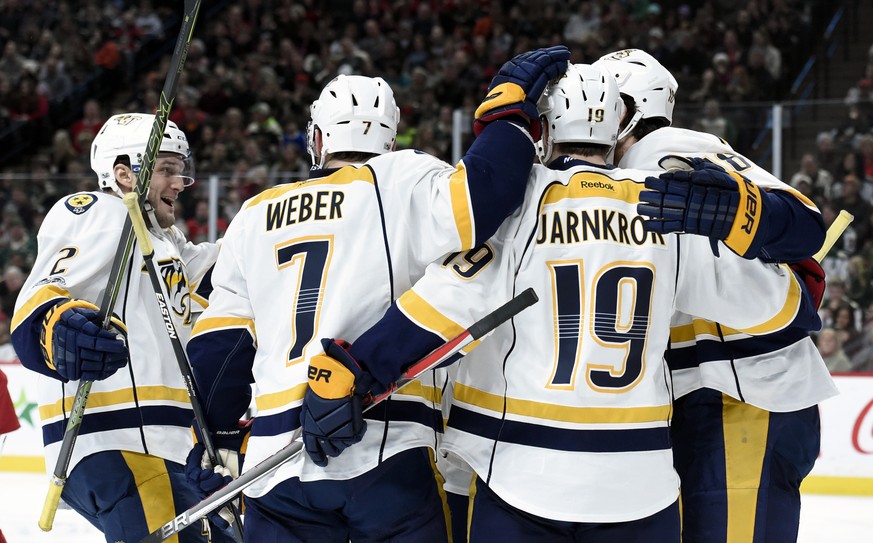 Nashville Predators&#039;s Anthony Bitetto (2), Yannick Weber (7), of Switzerland, and Calle Jarnkrok (19), of Sweden, congratulate right wing James Neal (18) on scoring against the Minnesota Wild dur ...