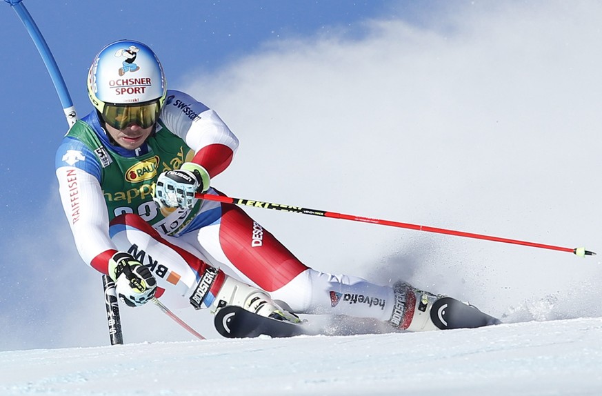 epa05659225 Gino Caviezel of Switzerland in action during the men&#039;s Giant Slalom 1st run race at the FIS Alpine Skiing World Cup in Val D&#039;Isere, France, 04 December 2016. EPA/GUILLAUME HORCA ...