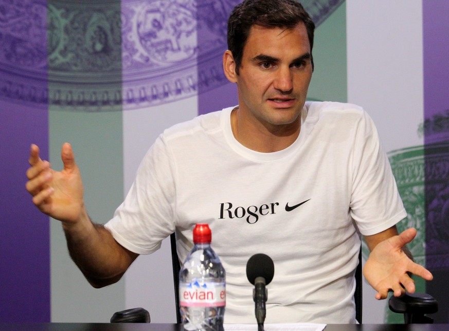 epa06091682 A handout photo made available by the AELTC showing Roger Federer of Switzerland giving a press conference after winning the final match against Marin Cilic of Croatia at the All England L ...