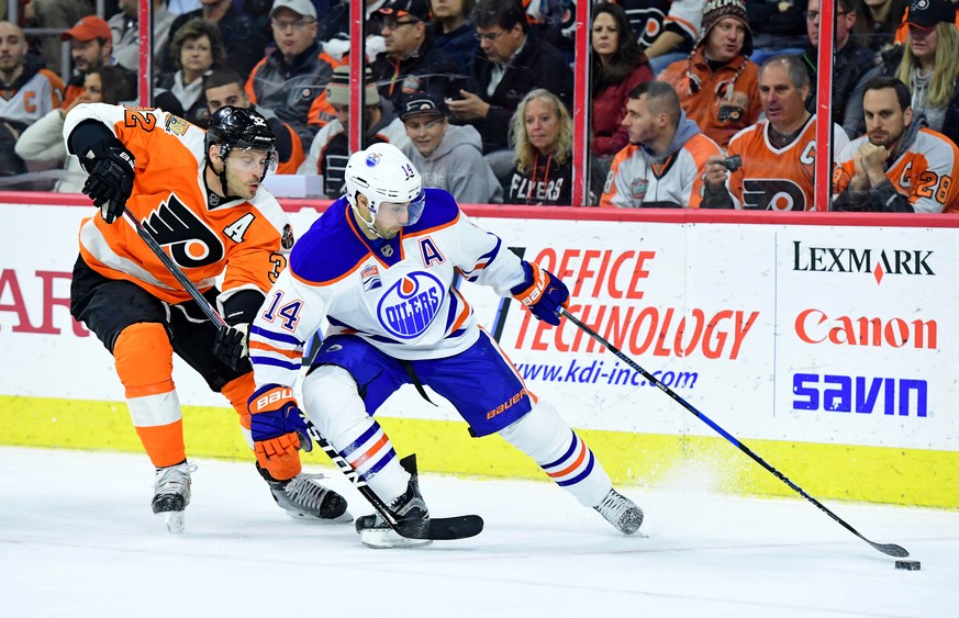 Dec 8, 2016; Philadelphia, PA, USA; Edmonton Oilers right wing Jordan Eberle (14) skates with the puck as Philadelphia Flyers defenseman Mark Streit (32) defends during the first period at Wells Fargo ...