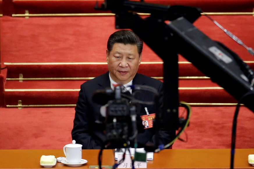Camera is seen in front of China&#039;s President Xi Jinping attending the second plenary session of the National People&#039;s Congress (NPC) at the Great Hall of the People in Beijing, China March 8 ...
