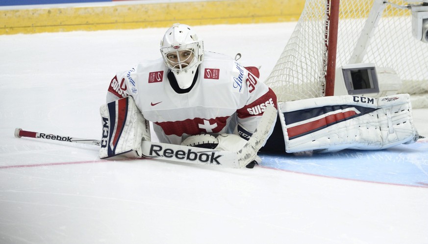 Swiss goalie Joren von Pottelberghe lies on ice after the 2016 IIHF World Junior U20 Ice Hockey Championships tournament match Switzerland vs Canada in Helsinki, Finland December 29, 2015. REUTERS/Hei ...