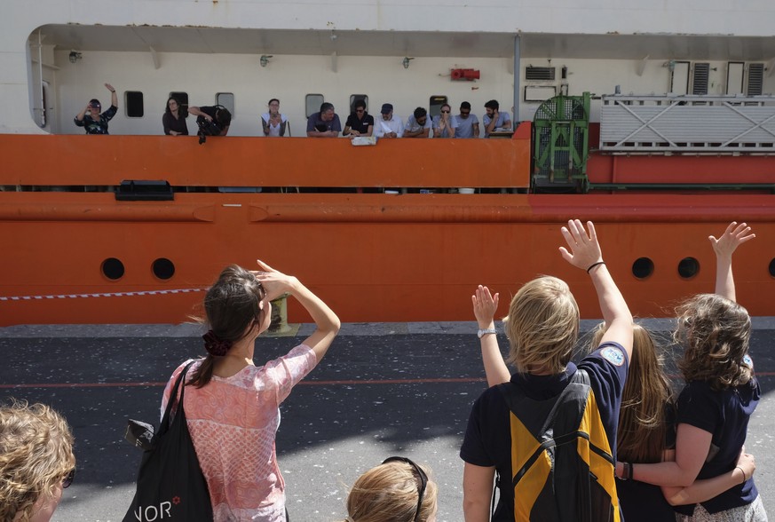 Team members wave from the deck aboard the Akademik Treshnikov, a Russian research vessel in Cape Town, South Africa, Tuesday, Dec. 20, 2016 on it&#039;s departure for the Antactic. It&#039;s aim is t ...