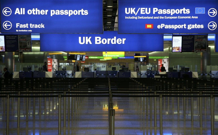 UK Border control is seen in Terminal 2 at Heathrow Airport in London June 4, 2014. REUTERS/Neil Hall/File Photo