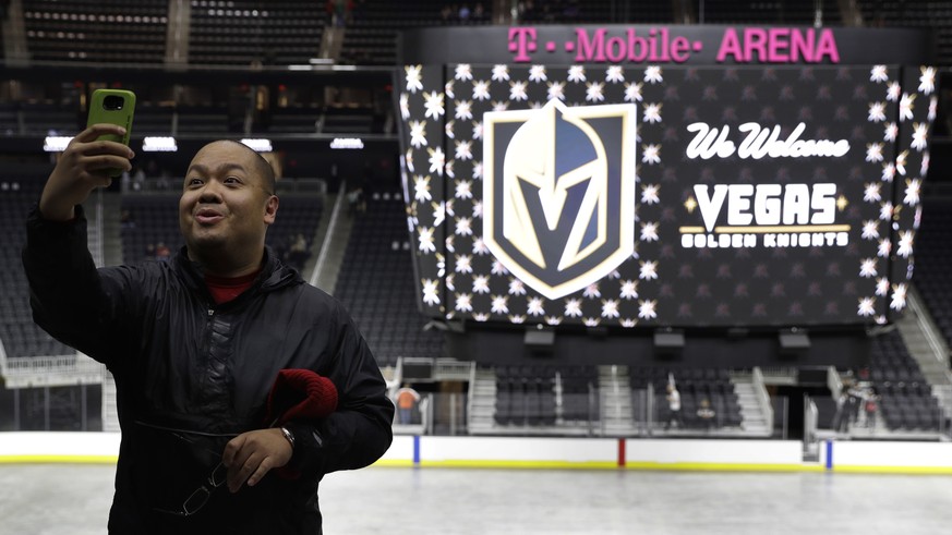 Jay Deogracias takes a selfie during an event to unveil the name of Las Vegas&#039; National Hockey League franchise, Tuesday, Nov. 22, 2016, in Las Vegas. The team will be called the Vegas Golden Kni ...