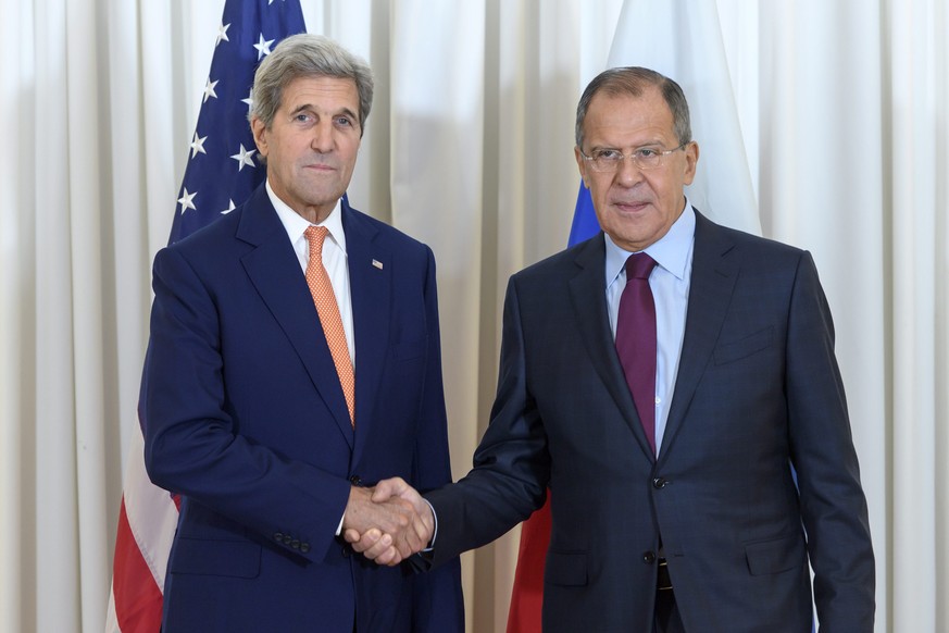 epa05510602 U.S. Secretary of State John Kerry (L) and Russian Foreign Minister Sergei Lavrov (R) shake hands prior a bilateral meeting in Geneva, Switzerland, 26 August 2016. The talks focus on the S ...