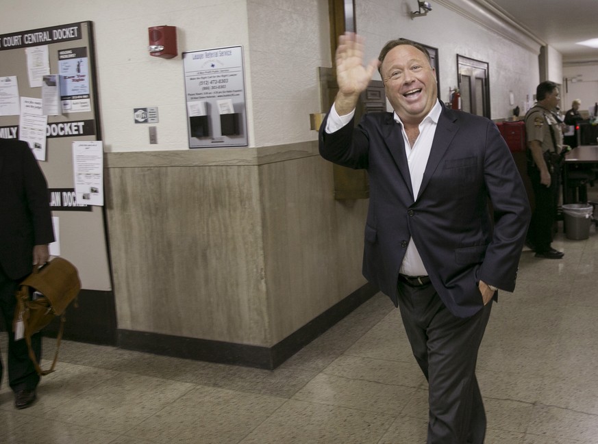 Alex Jones, a well-known Austin-based broadcaster and provocateur, arrives for a child custody trial at the Heman Marion Sweatt Travis County Courthouse in Austin, Texas, on Wednesday April 19, 2017.  ...