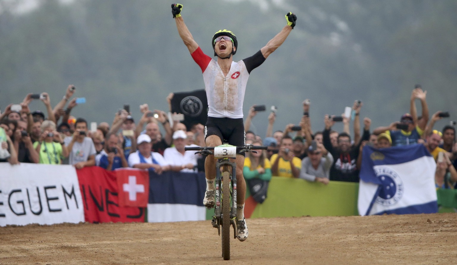 2016 Rio Olympics - Cycling mountain bike - Final - Men&#039;s Cross-country Race - Mountain Bike Centre - Rio de Janeiro, Brazil - 21/08/2016. Nino Schurter (SUI) of Switzerland celebrates after cros ...