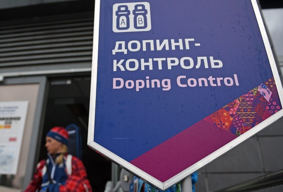 epa04092792 An athlete walks past the sign at the Doping Control Station in Laura Biathlon Center at the Sochi 2014 Olympic Games, Krasnaya Polyana, Russia, 21 February 2014. Biathlete and double Olym ...