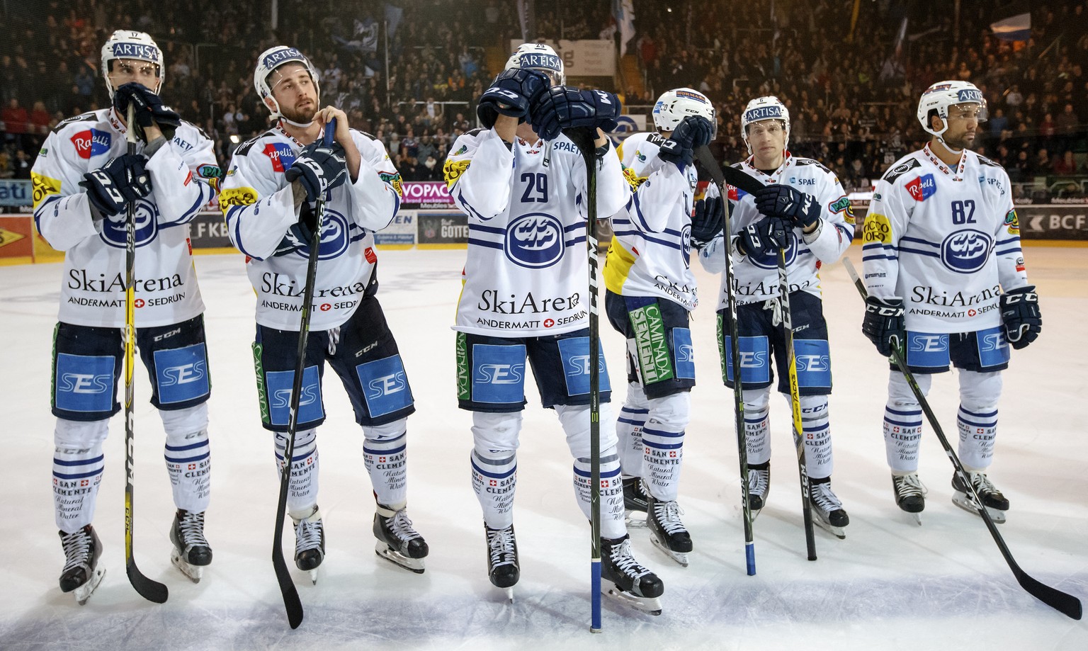 Ambri-Piotta&#039;s players looks on disappointed after losing against Fribourg, during the game of National League A (NLA) Swiss Championship between HC Fribourg Gotteron and Ambri-Piotta, at the ice ...