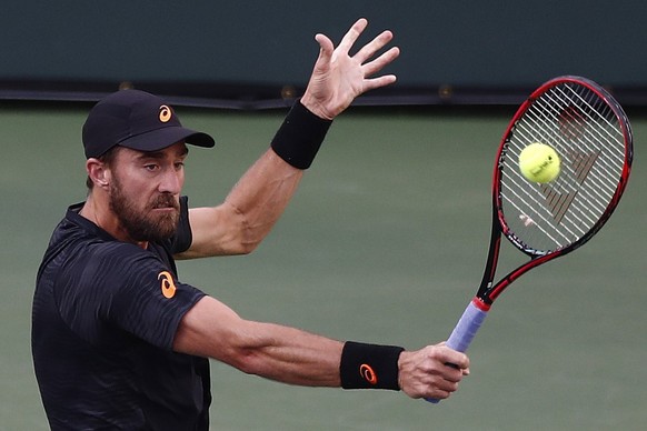 epa05848750 Steve Johnson of the USA returns a shot to Roger Federer of Switzerland during their match at the 2017 BNP Paribas Open tennis tournament at the Indian Wells Tennis Garden in Indian Wells, ...