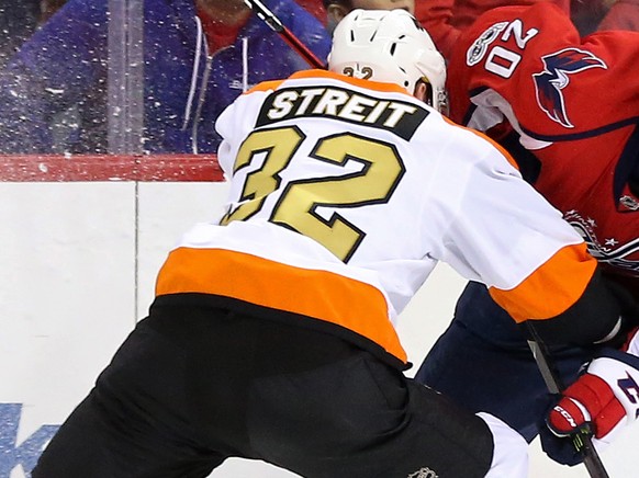 Jan 15, 2017; Washington, DC, USA; Washington Capitals center Lars Eller (20) and Philadelphia Flyers defenseman Mark Streit (32) battle for the puck in the third period at Verizon Center. The Capital ...