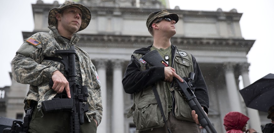 Gun rights advocates Stephen Korte, left and his brother Austin Barnes demonstrate on the steps of the state Capitol Tuesday, April 29, 2014, in Harrisburg, Pa. The event titled Pennsylvania Second Am ...