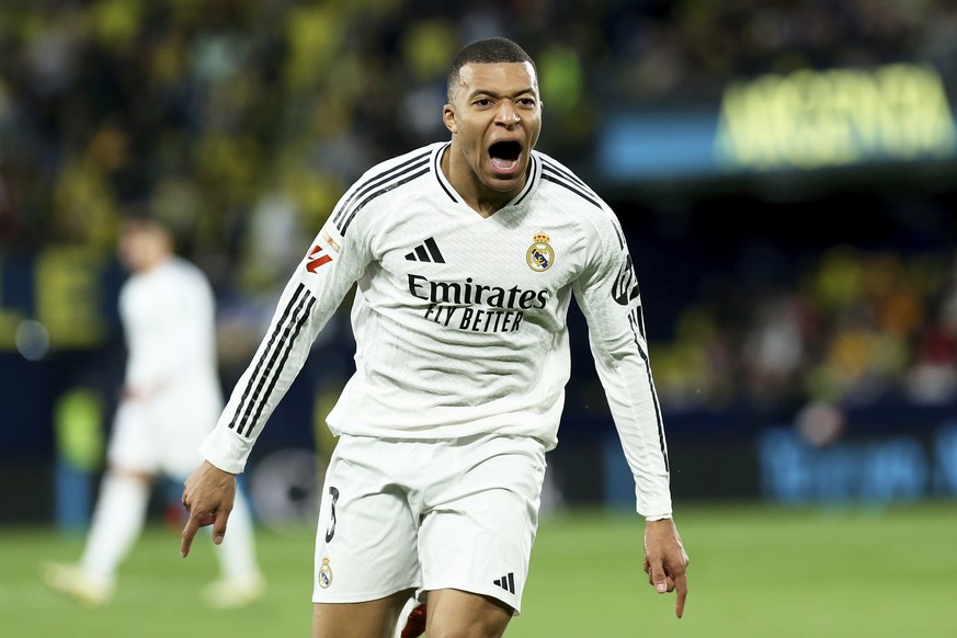 Nachrichten Linkding Real Madrid's Kylian Mbappe celebrates after scoring his side's second goal during a Spanish La Liga soccer match between Villarreal and Real Madrid in Villarreal, Spain, Saturday, March 15, ...