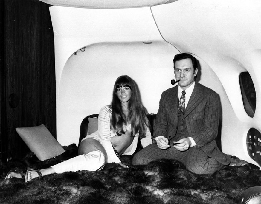 The president of Playboy Enterperises, Hugh Hefner with girlfriend, Barbi Benton in his luxury DC-9 aircraft &#039;The Big Bunny&#039; at Heathrow. The couple are en route to an extended holiday aroun ...