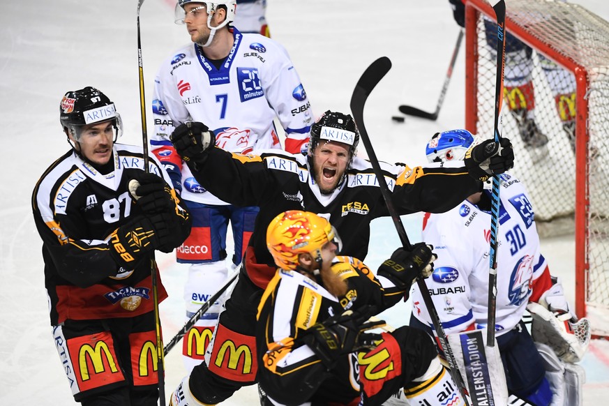 From left Lugano’s player Dario Bürgler, Lugano’s player Tony Martensson and Lugano’s player Linus Klasen celebrate 1-0 goal during the second leg of the Playoffs quarterfinals game of National League ...