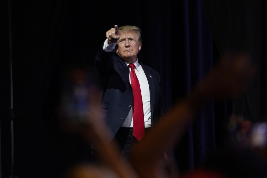 Former President Donald Trump points to supporters after speaking at a Turning Point Action gathering, Saturday, July 24, 2021, in Phoenix. (AP Photo/Ross D. Franklin)