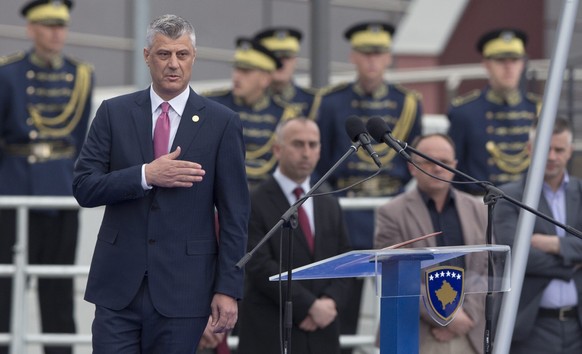 epa05249507 Newly elected President of the Republic of Kosovo Hashim Thaci during the inauguration ceremony in Pristina, Kosovo, 08 April 2016. Supporters of the opposition threw few tear gas cans dur ...
