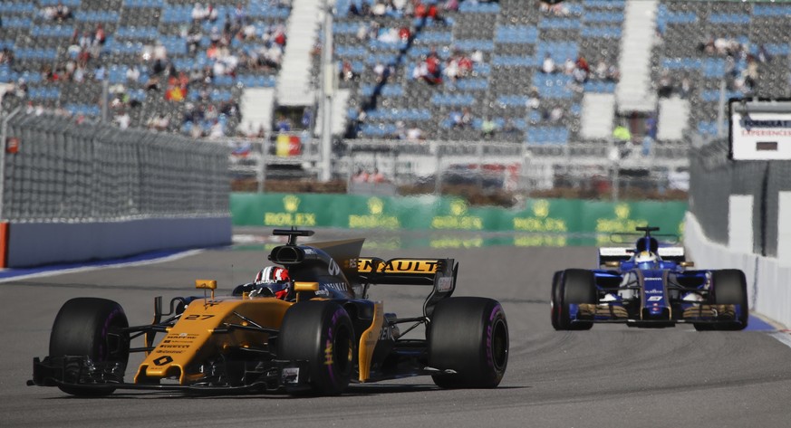 Renault driver Nico Hulkenberg of Germany leads Sauber driver Marcus Ericsson of Sweden during the second free practice session ahead the Formula One Russian Grand Prix at the &#039;Sochi Autodrom&#03 ...