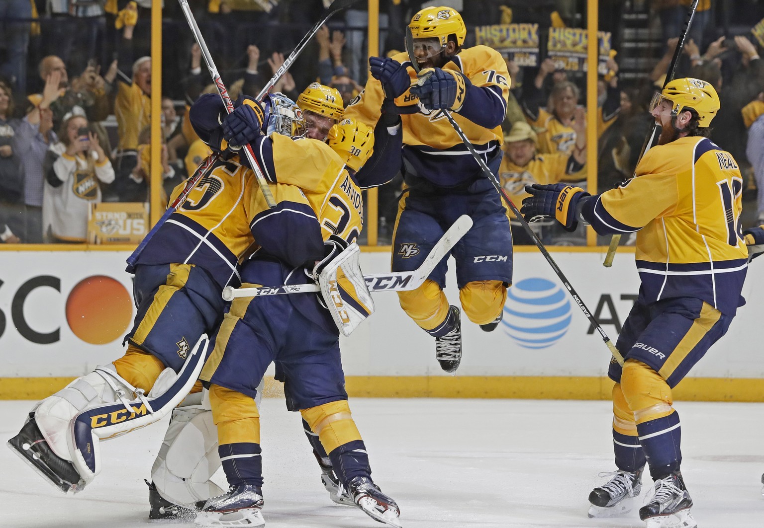 Nashville Predators players including defenseman P.K. Subban, second from right, celebrate with goalie Pekka Rinne, of Finland, left, after winning Game 6 of the Western Conference final against the A ...