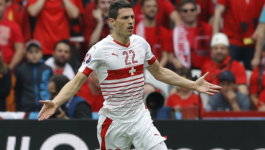 Switzerland&#039;s Fabian Schaer celebrates with teammates after scoring his side&#039;s first goal during the Euro 2016 Group A soccer match between Albania and Switzerland, at the Bollaert stadium i ...