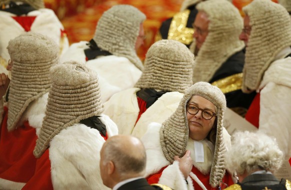 Members of the Law Lords, Britain&#039;s senior judiciary, take their seats as they wait for Britain&#039;s Queen Elizabeth to read the Queen&#039;s Speech during the State Opening of Parliament in th ...