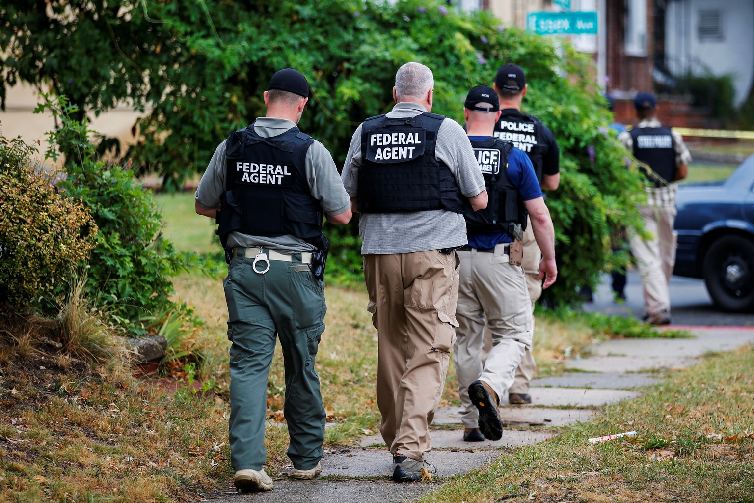 Federal Agents walk near the site where Ahmad Khan Rahami, sought in connection with a bombing in New York, was taken into custody in Linden, New Jersey, U.S., September 19, 2016. REUTERS/Eduardo Muno ...