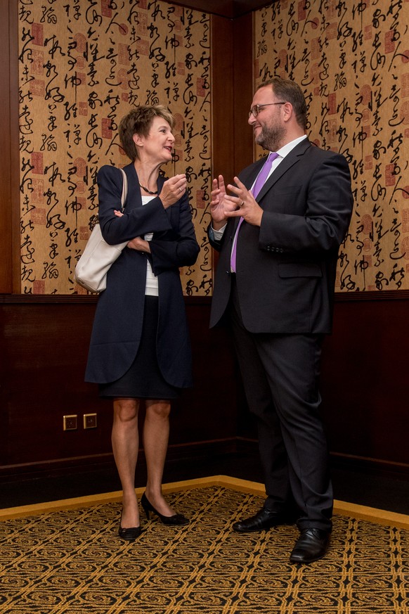 Swiss Justice Minister Simonetta Sommaruga, left, and Norman Gobbi, state councilor of Ticino, right, speak at an Interpol conference about the prevention of human traffiking, in Paradiso, Switzerland ...