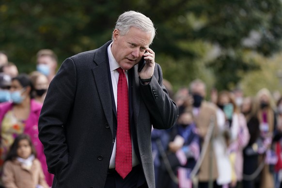 FILE - White House Chief of Staff Mark Meadows speaks on a phone on the South Lawn of the White House in Washington, on Oct. 30, 2020. A revelation about text messages sent by three Fox News personali ...