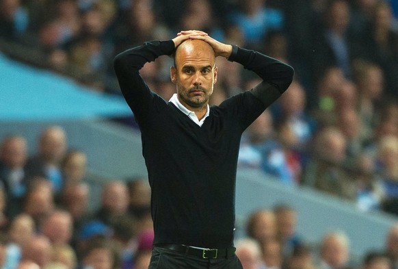 epa06155298 Manchester City manager Pep Guardiola reacts during the English Premier League soccer match between Manchester City and Everton FC in Manchester, Britain, 21 August 2017. EPA/PETER POWELL  ...