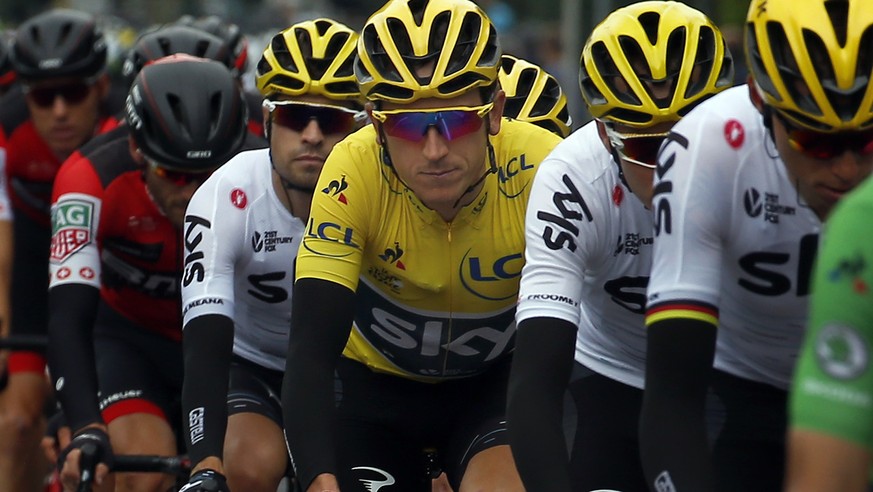 Britain&#039;s Geraint Thomas wearing the overall leader&#039;s yellow jersey, center, ride in the pack during the second stage of the Tour de France cycling race over 203.5 kilometers (126.5 miles) w ...