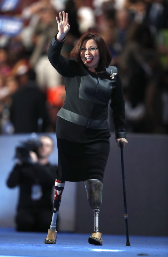 Rep. Tammy Duckworth, D-Ill., walks to the podium during the final day of the Democratic National Convention in Philadelphia , Thursday, July 28, 2016. (AP Photo/Paul Sancya)