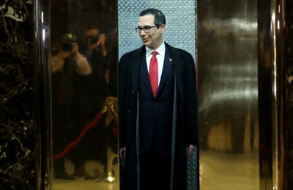 epa05653556 Steven Mnuchin arrives at Trump Tower, where President-elect Donald Trump lives and has an office, in New York, New York, USA, 30 November 2016. Steven Mnuchin is expected to be announced  ...