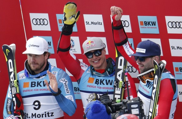 Alpine Skiing - FIS Alpine Skiing World Championships - Men&#039;s Super G - St. Moritz, Switzerland - 8/02/17 - Gold medalist Eric Guay of Canada is flanked by Norway&#039;s silver medalist Kjetil Ja ...