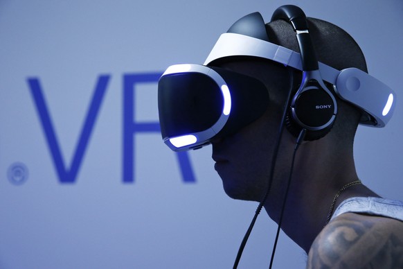 A visitor plays a game on a PlayStation VR at the Paris Games Week, a trade fair for video games in Paris, France, October 28, 2015. Paris Games week will run from October 28 to November 1, 2015. REUT ...