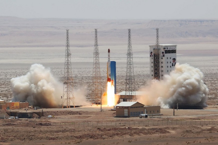 epa06113103 A handout photo made available by the Iranian Defence ministry official website shows Simorgh satellite rocket lunching at the Imam Khomeini National space Centre in an undisclosed locatio ...