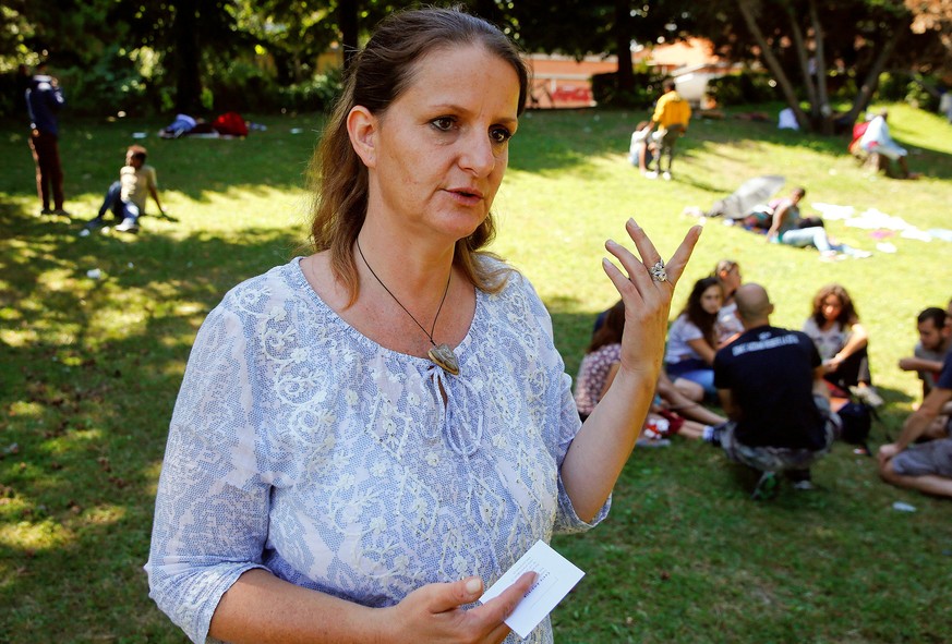 Swiss Lisa Bosia Mirra of the private aid organisation Associazone Firdaus talks to journalists during her visit to a makeshift camp at a park near the San Giovanni railway station in Como, Italy Augu ...