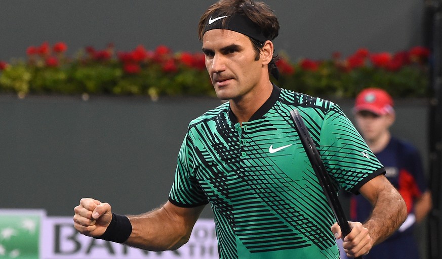 Mar 14, 2017; Indian Wells, CA, USA; Roger Federer (SUI) pumps his fist after match point as he defeats Steve Johnson (not pictured) 7-6, 7-6 in the BNP Paribas Open at the Indian Wells Tennis Garden. ...