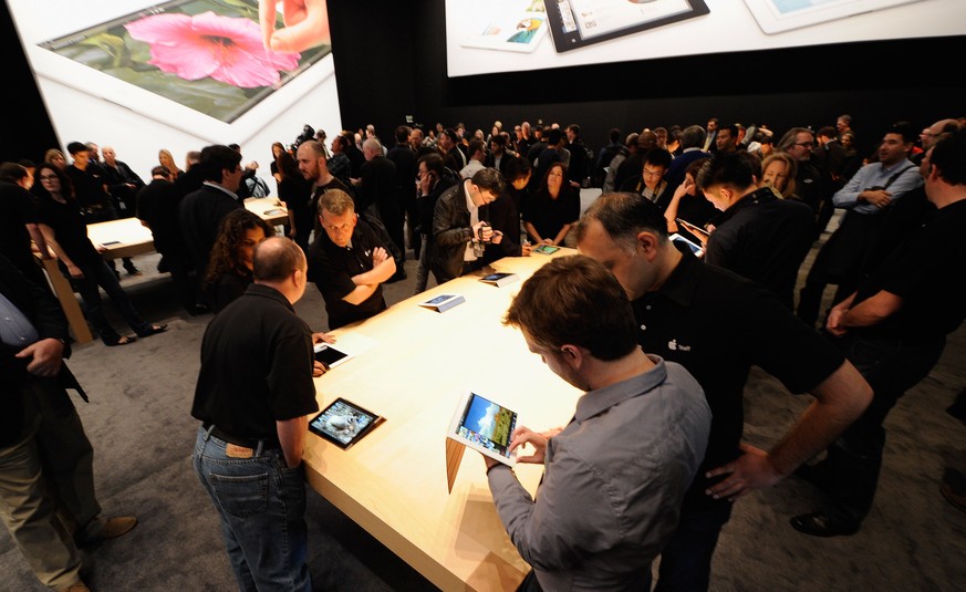 SAN FRANCISCO, CA - MARCH 07: Members of the media preview the new iPad during an Apple product launch event at Yerba Buena Center for the Arts on March 7, 2012 in San Francisco, California. In the fi ...