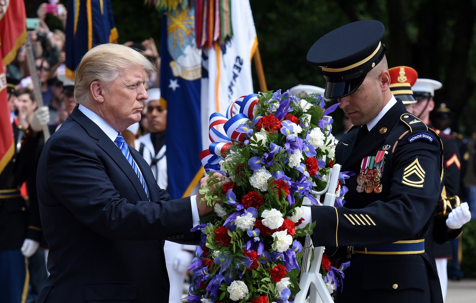 epa05997956 US President Donald J. Trump participates in a wreath-laying ceremony at the Tomb of the Unknown Soldier at Arlington National Cemetery on Memorial Day, in Arlington, Virginia, USA, 29 May ...