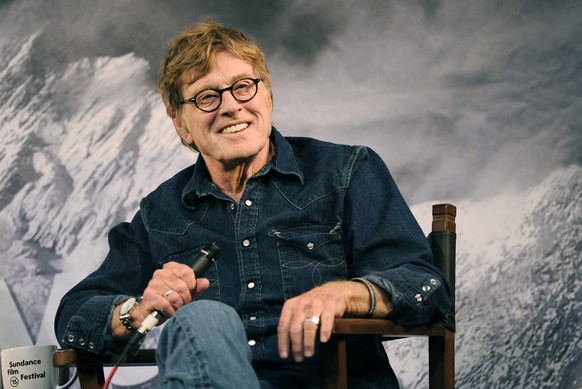 FILE - In this Jan. 22, 2015 file photo, Robert Redford, founder of the Sundance Institute, interacts with the media during the opening day press conference at the 2015 Sundance Film Festival in Park  ...