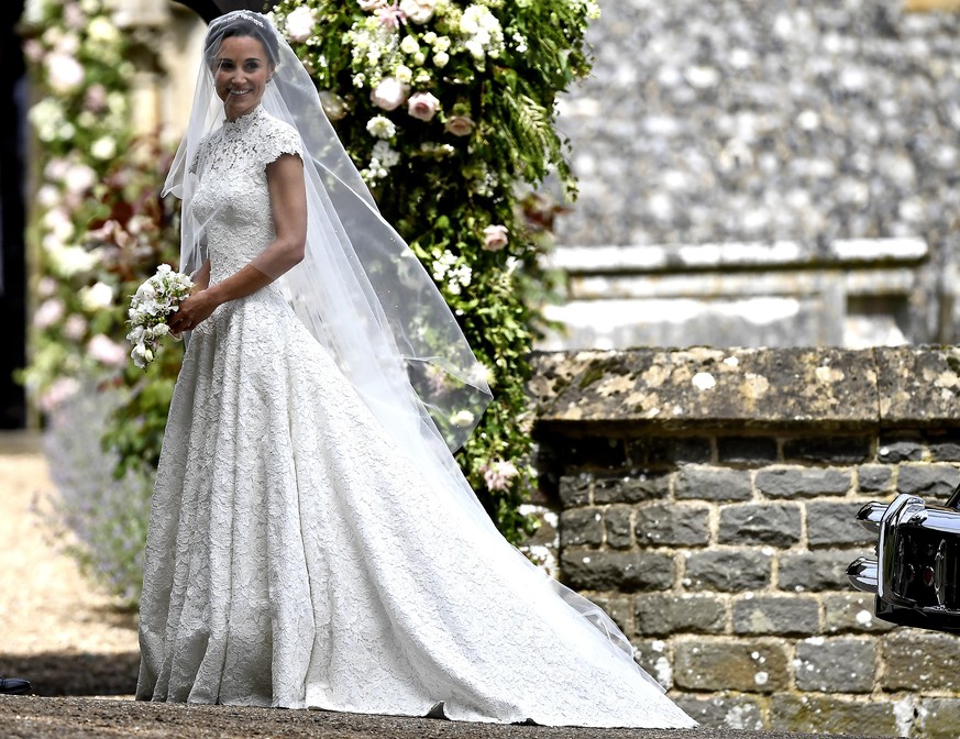 Pippa Middleton arrives for her wedding to James Matthews, at St Mark’s Church in Englefield, England, Saturday, May 20, 2017. Middleton, the younger sister of Kate, Duchess of Cambridge is to marry h ...