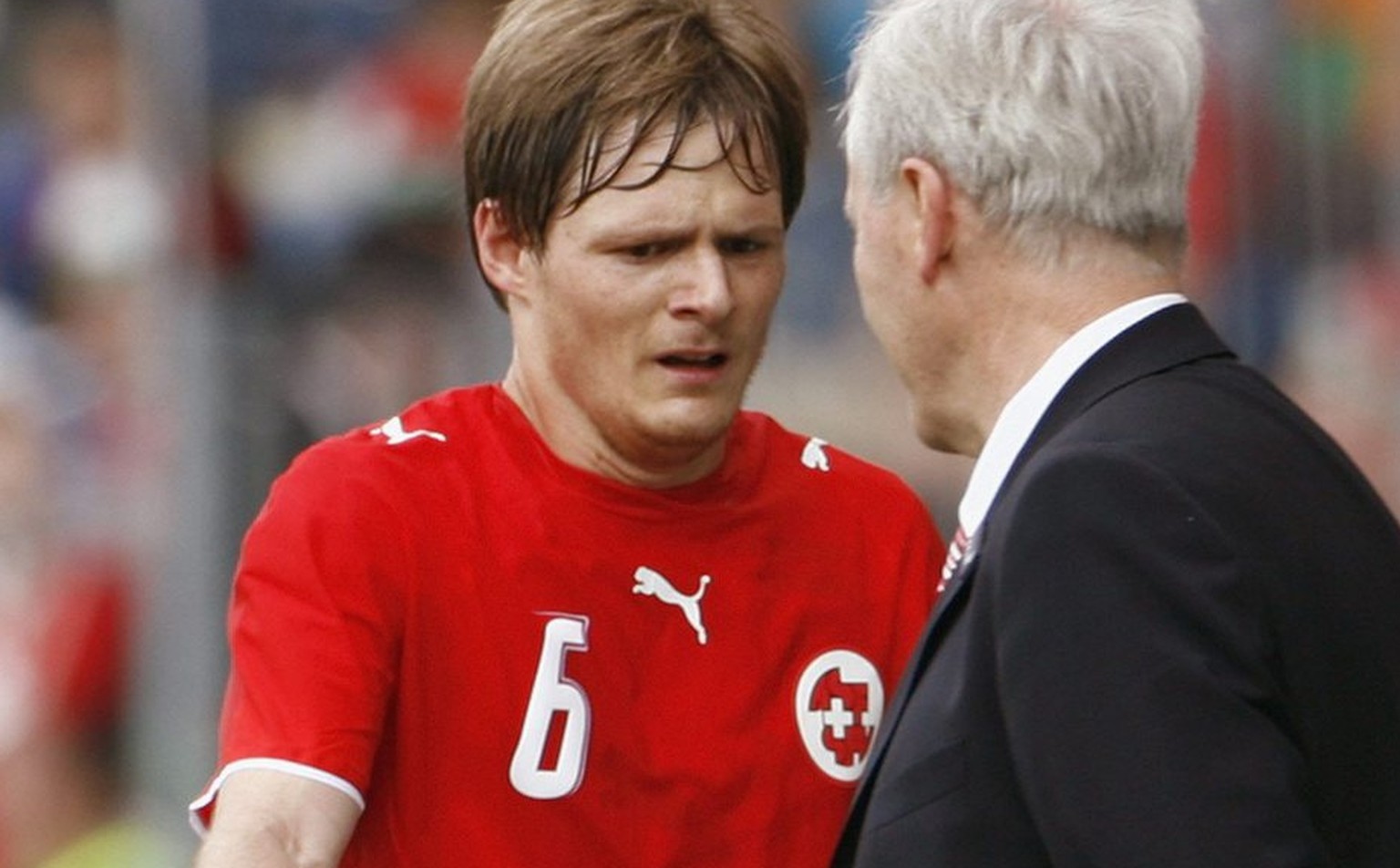 Swiss coach Jakob &quot;Koebi&quot; Kuhn, right, acknowledges his player Johann Vogel leaving the pitch after Vogel&#039;s substitution, during a test match between the national soccer teams of Switze ...